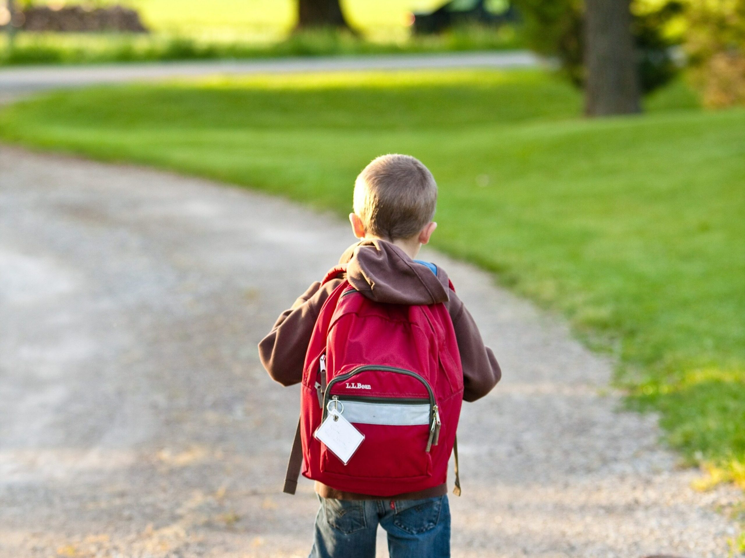 Children hunched like camels.  What are the dangers of carrying a heavy backpack?