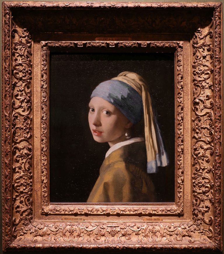 The activist glued his head to “Girl with a Pearl Earring.”  “How do you feel?”